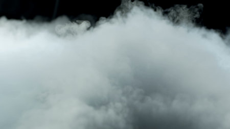 Photo of Realistic Clouds, Smoke, Dry Ice Smoke Texture on black dark Background. For website background, print wallpapers, office or design element, posters and more.の写真素材