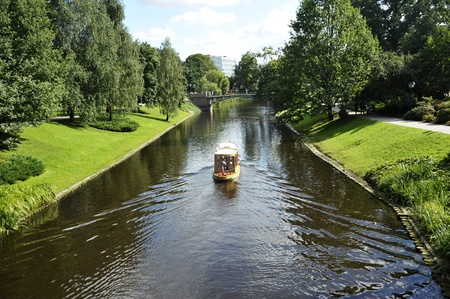 Walking boat on the city channel in Riga (Latvia)の写真素材