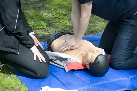 Salvation the person. Training to performance of artificial breath on a dummy.の写真素材