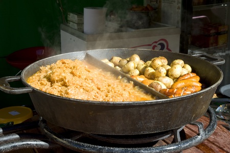 Rural meal. The big frying pan with hot mealの写真素材
