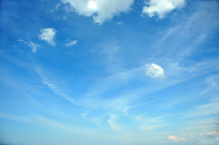 White clouds at a background of the blue skyの写真素材