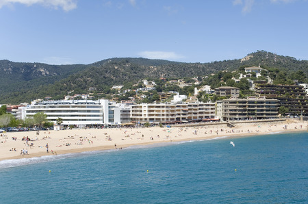 Spain. A beach in the resort Tossa de Mar. View from the sea.の写真素材