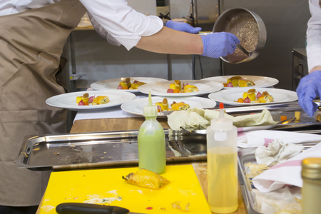 Preparation of delicious dishes in the kitchenの写真素材