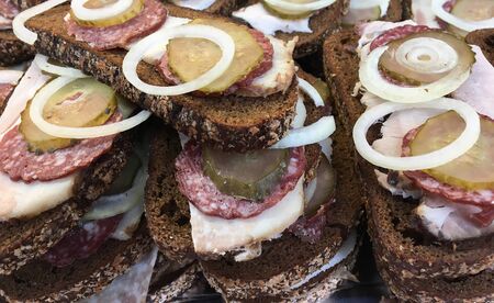 Sale of sandwiches with sausage and bacon in the bazaar during the holidaysの写真素材