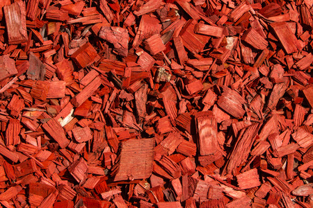 Wood chips. / Red lawn wood chips of different sizesの写真素材