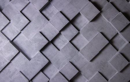 The gray textured wall is made of cubes