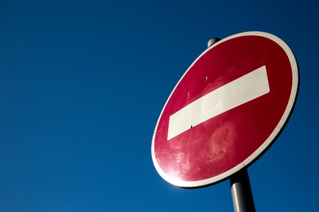 Road sign Passage is prohibited against the blue skyの写真素材