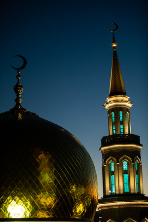 A beautiful mosque that features a crescent moon on its rooftopの写真素材