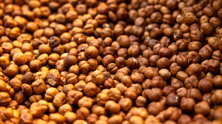 A closeup view of an abundant display showcasing an array of deliciously roasted nuts, perfectly arrangedの写真素材