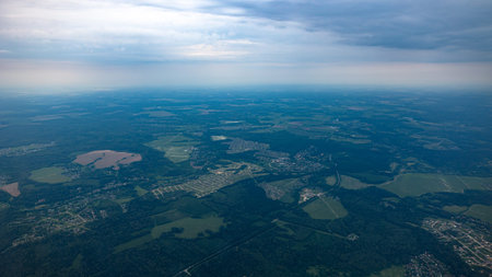 Aerial View of Beautiful, Lush, Verdant Landscape Under a Dramatic Overcast Sky Above