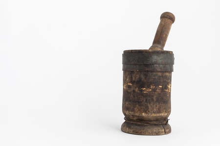 Mortar and pestle closeup in studio on white backgroundの写真素材