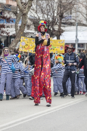 ALEXANDROUPOLIS, GREECE - MARCH 16: Unidentified participant of carnival parade in Alexandroupolis on March 16, 2013 in Evros, Alexandroupolis, Greece. Group of people dressed in colorful costumesのeditorial素材