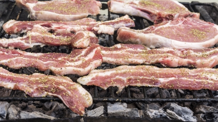 Preparation of grilled meat steak on fireの写真素材