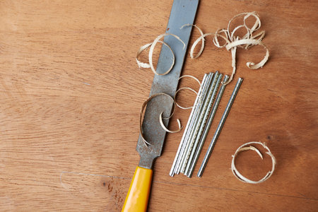 Bass guitar under construction, with tools and accessories.