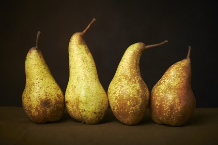 Yellow pears on a wooden tableの写真素材