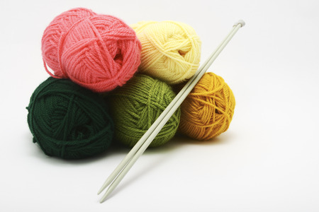 knitting needles and colorful wool ballsの写真素材