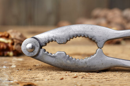 walnuts cracked open with a vintage nut cracker