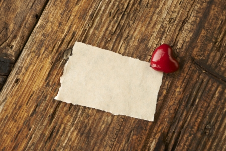 Valentines Day, red heart on wooden background の写真素材