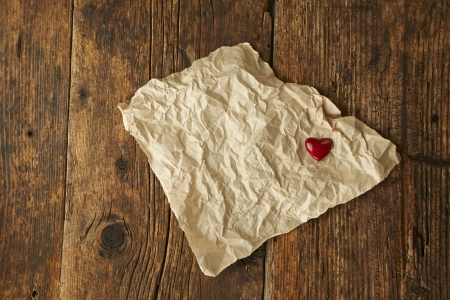Valentines Day, red heart on wooden background の写真素材