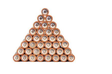 gold batteries in rows with silver tops close upの写真素材
