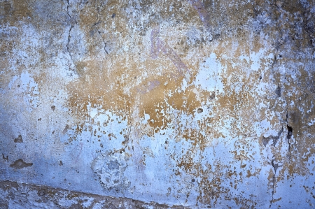 construction, old cracked paint wall as a backgroundの写真素材