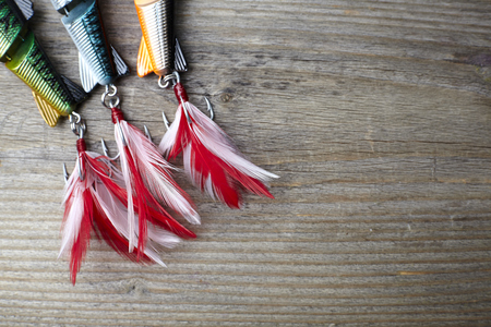 colorful lures on the wooden pierの写真素材