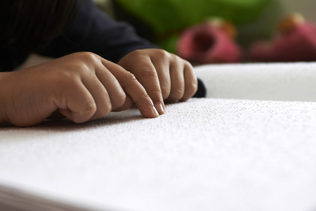 blind children read text in braille languageの写真素材