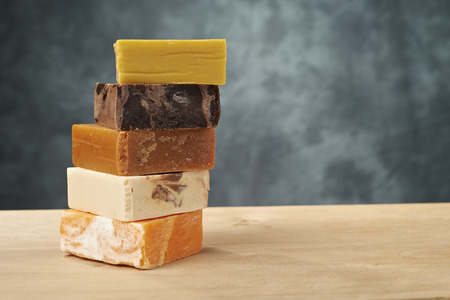 colorful soaps on a wooden tableの写真素材