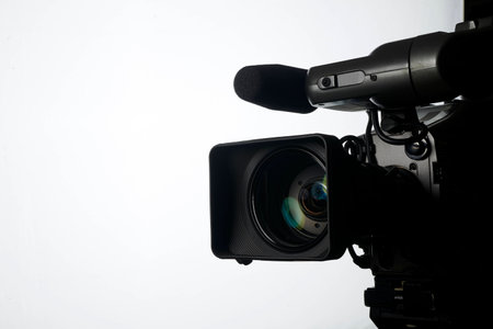 Professional digital video camera, isolated on white の写真素材