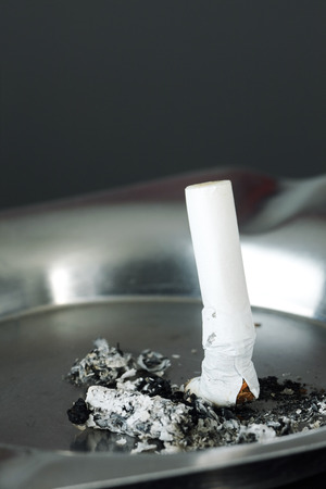 single cigarette butt in an ashtray.の写真素材
