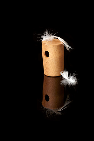 wooden whistles for calling ducks with a featherの写真素材