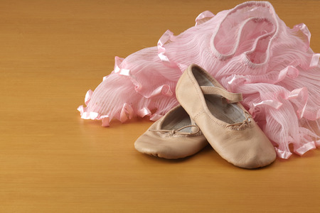 pair of ballet shoes on wooden floor
の写真素材