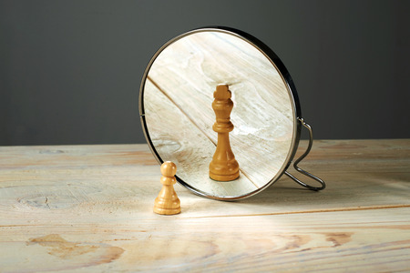 Alter ego. Be someone else, a soldier and a king chessmen mirroring. Alter ego. Be someone else, a soldier and a king chessmen mirroring.