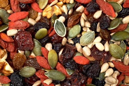 mix nuts seeds and dry fruits, on a wooden tableの写真素材