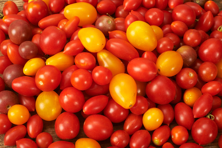 fresh tomato on a wooden kitchen tableの写真素材