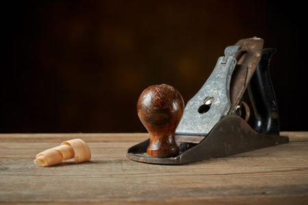 Woodworking tool. Hand plane on a wooden workbench.
