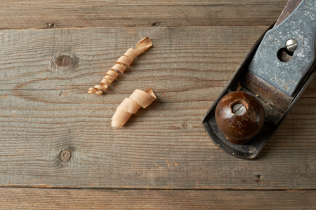 Woodworking tool. Hand plane on a wooden workbench.の写真素材