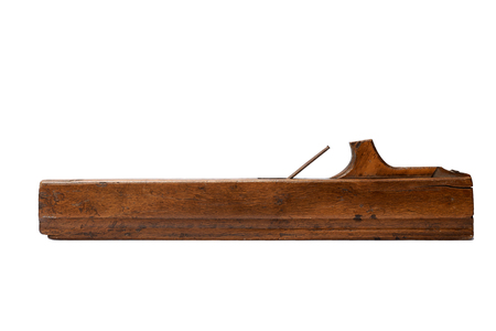 Woodworking tool. Traditional wooden hand plane isolated on a white backgroundの写真素材