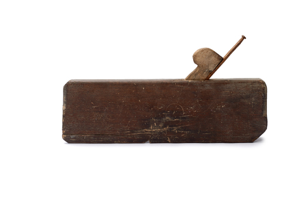 Woodworking tool. Traditional wooden hand plane isolated on a white backgroundの写真素材