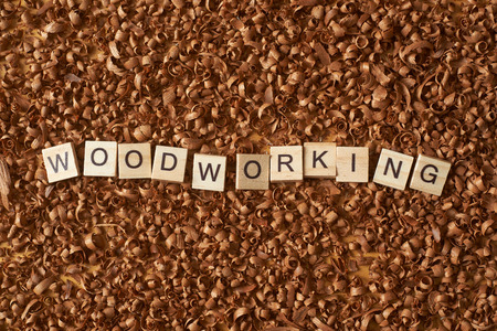 Woodworking word writen with letters on wood chipsの写真素材