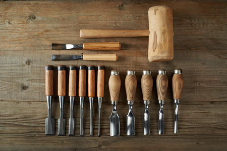Top view, chisels and mallet on a workbenchの写真素材