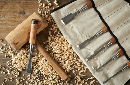 Top view, chisels and mallet on a workbenchの写真素材