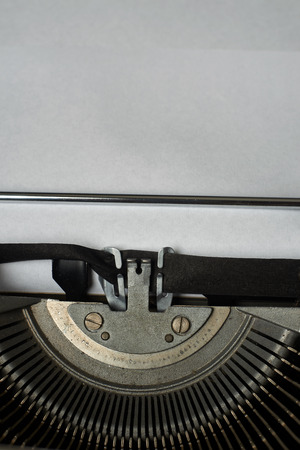 blank sheet of paper, ready to type words on a Vintage Typewriterの写真素材