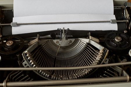 blank sheet of paper, ready to type words on a Vintage Typewriterの写真素材