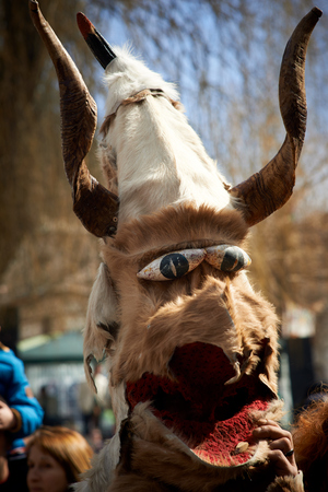 SHIROKA LAKA, BULGARIA - MARCH 5: People dressed in traditional costumes called Kukeri celebrate arrival of Spring with ritual dances in Shiroka Laka, Bulgaria, on March 5, 2017.のeditorial素材