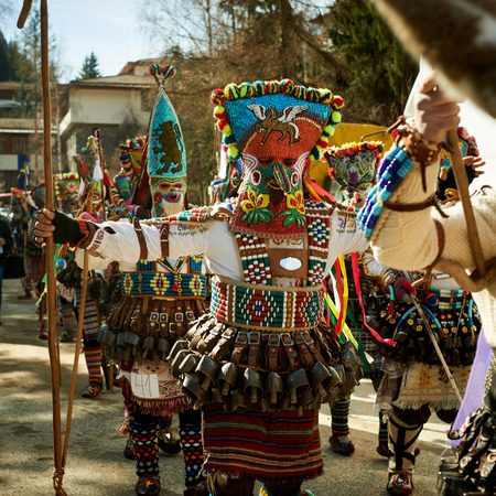 SHIROKA LAKA, BULGARIA - MARCH 5: People dressed in traditional costumes called Kukeri celebrate arrival of Spring with ritual dances in Shiroka Laka, Bulgaria, on March 5, 2017.のeditorial素材