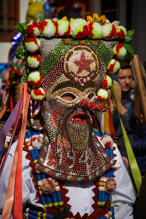 SHIROKA LAKA, BULGARIA - MARCH 5: People dressed in traditional costumes called Kukeri celebrate arrival of Spring with ritual dances in Shiroka Laka, Bulgaria, on March 5, 2017.のeditorial素材