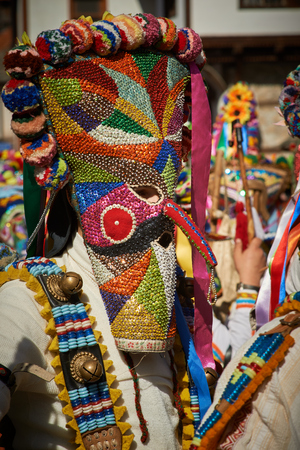 SHIROKA LAKA, BULGARIA - MARCH 5: People dressed in traditional costumes called Kukeri celebrate arrival of Spring with ritual dances in Shiroka Laka, Bulgaria, on March 5, 2017.のeditorial素材