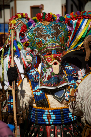 SHIROKA LAKA, BULGARIA - MARCH 5: People dressed in traditional costumes called Kukeri celebrate arrival of Spring with ritual dances in Shiroka Laka, Bulgaria, on March 5, 2017.のeditorial素材