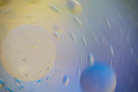 wallpaper with two large drops around them in motion, many small ones, the color smoothly passes...